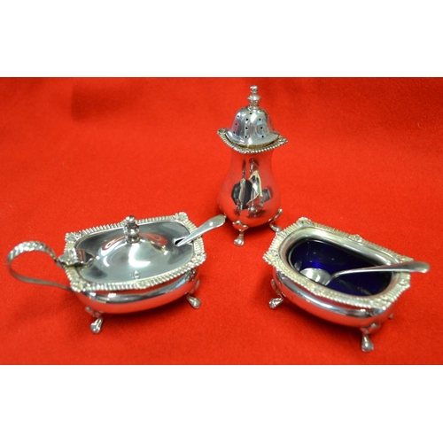 279 - A Georgian design three piece silver condiment set, comprising pepper pot, salt (with blue glass lin... 