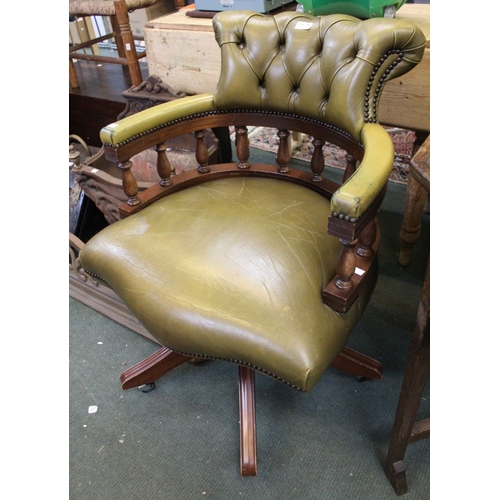 301 - A green upholstered swivel Captains chair with button back