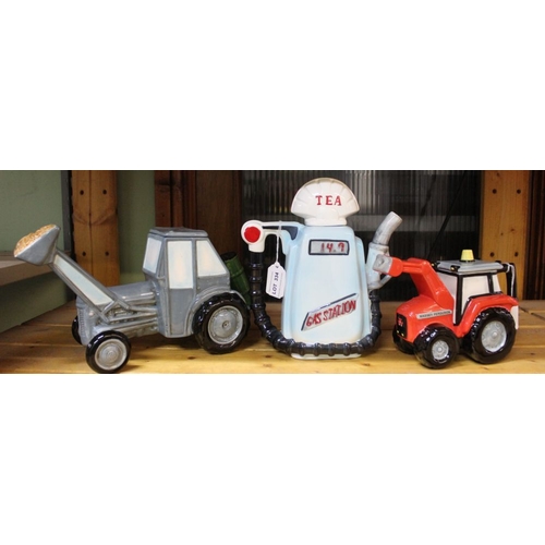 334 - A teapot in the form of a petrol ump, together with two teapots in the form of farming vehicles (3)