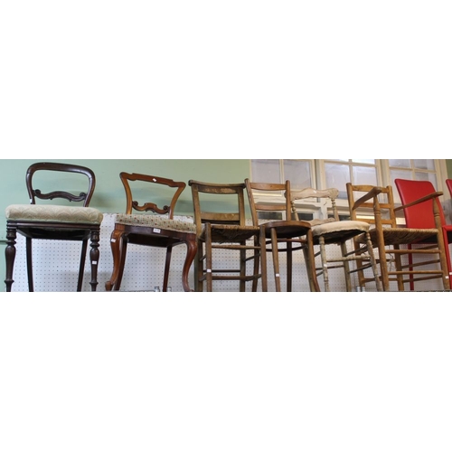 349 - A selection of seven chairs, to include two rush seated