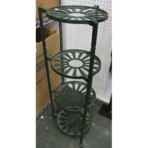 364 - A cast iron green painted four tier pan stand