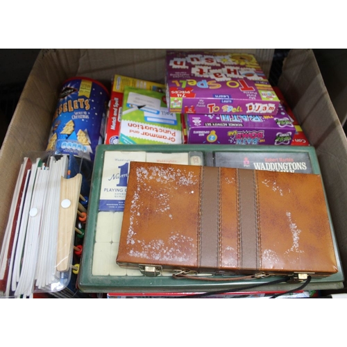 380 - A box containing a selection of children's puzzles, games, etc