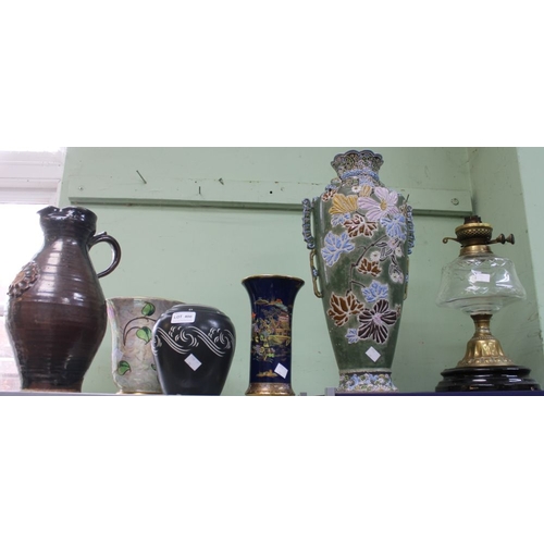 400 - A studio pottery jug with a Carlton ware vase and an oil lamp etc