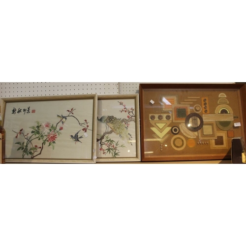 49 - Two Japanese silk embroidery works glazed and framed with a geometric fabric work (3)