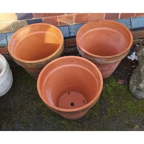 533 - Three terracotta pots, the tallest 32cm high, external top diameter 37cm in diameter