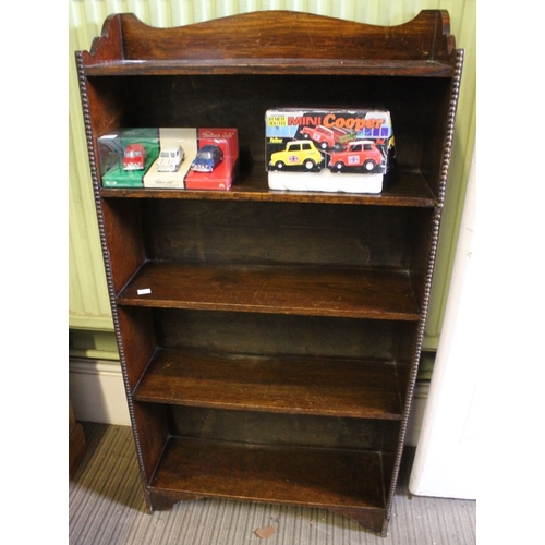 58 - A small bookcase with beaded front, five shelves