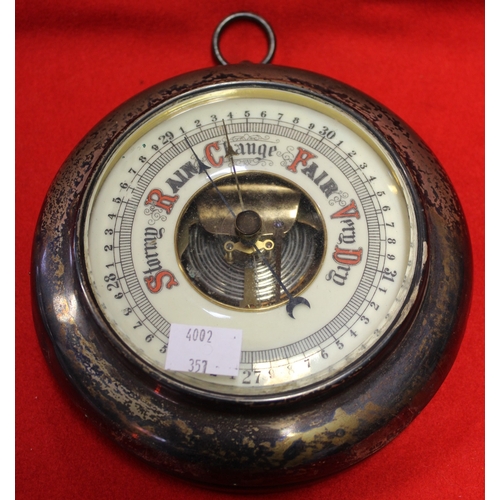 83 - A silver mounted barometer