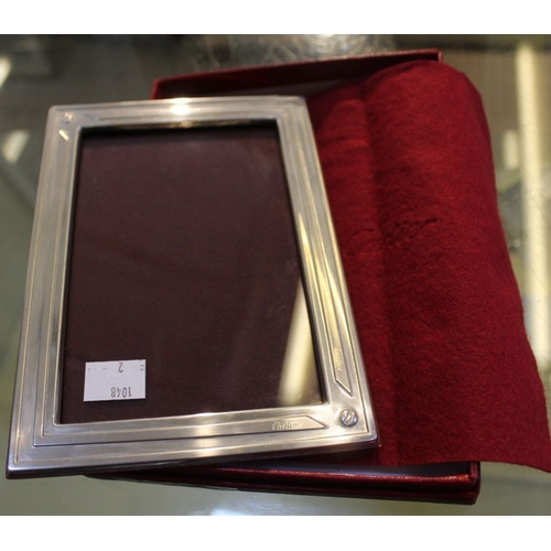 87 - A photograph frame in red box, bears name, Overall size 18cm x 13cm, to show an image 15cm x 10cm