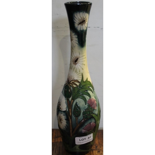 91 - A Moorcroft pottery vase of elongated baluster form, Thistle Down pattern, various impressed & paint... 