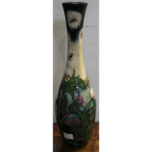 91 - A Moorcroft pottery vase of elongated baluster form, Thistle Down pattern, various impressed & paint... 