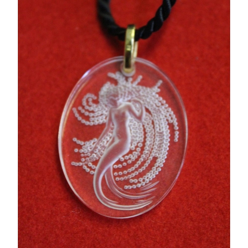 98 - A millennium Lalique clear and frosted glass intaglio pendant, depicting a Naide water sprite. Set i... 