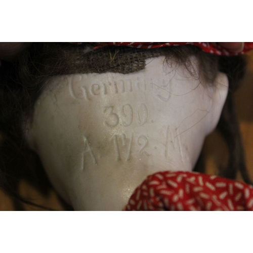 146 - An Armand Marseille bisque head doll, the back of the neck inscribed, including the numbers 390 and ... 