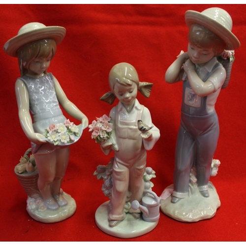 245 - Five Lladro ceramic figures includes two with wheelbarrows of flowers (5)