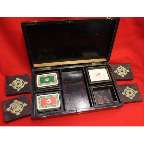 250 - A late Victorian brass banded playing card box, the banding in the form of buckled straps, 27cm