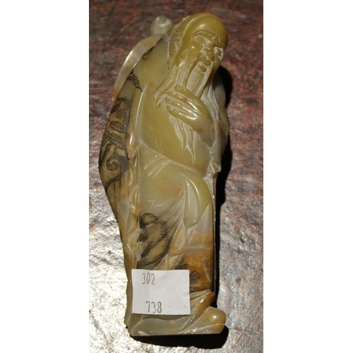 269 - A Chinese carved soapstone figure of a bearded man, 12.5 cm