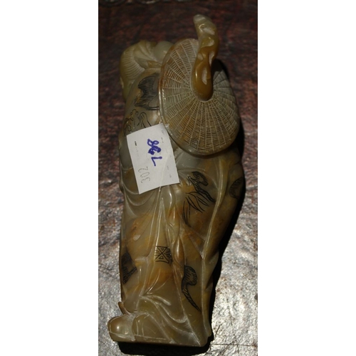 269 - A Chinese carved soapstone figure of a bearded man, 12.5 cm