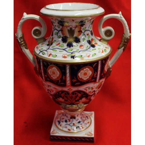 270 - Two Derby early 19th century ceramic vases, of urn form, both painted and gilded in the Imari palett... 