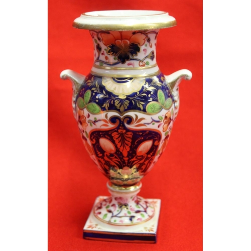 270 - Two Derby early 19th century ceramic vases, of urn form, both painted and gilded in the Imari palett... 