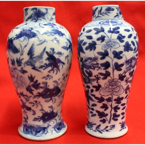 274 - Two Chinese vases, blue & white hand painted, one with dragon decoration, both with covers & both be... 