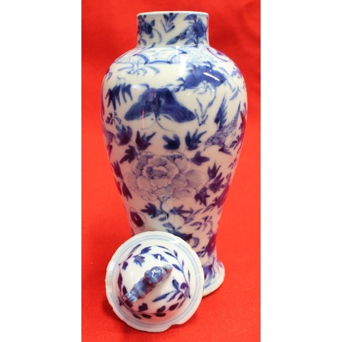 274 - Two Chinese vases, blue & white hand painted, one with dragon decoration, both with covers & both be... 