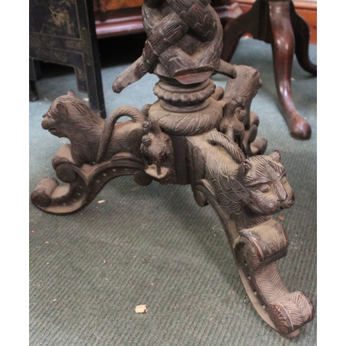 417 - A late 19th century Indo-European carved tilt top occasional table, with entwined serpent stem & car... 