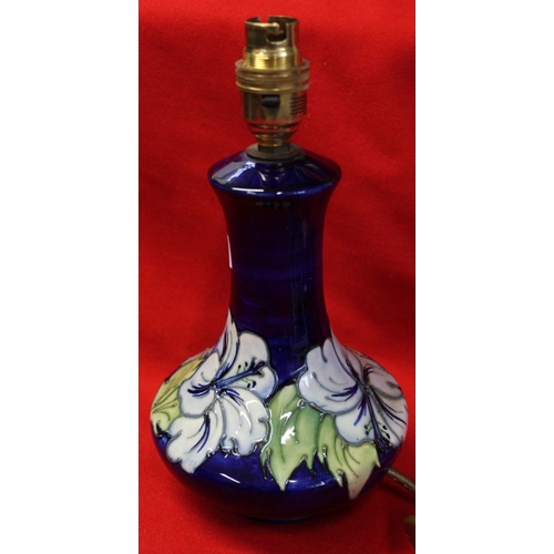 478 - A Moorcroft pottery table lamp, of mallet form, tube lined and painted Blue Hibiscus decoration