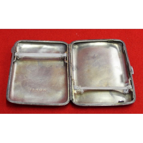 621 - A silver cigarette case, small silver bowl and a pair of loaded silver candlesticks, weighable silve... 