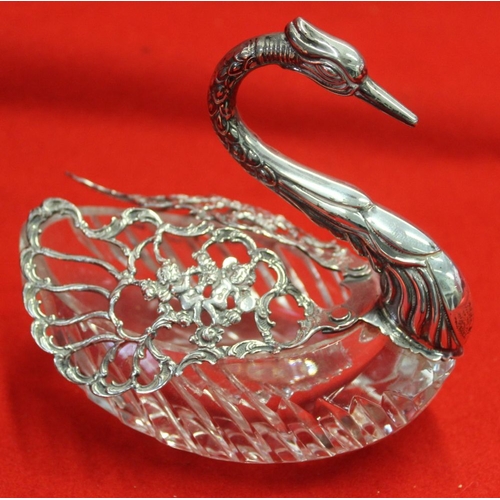 625 - A cut glass swan bowl, silver mounted with embossed and pierced revolving wings, 12cm high, (one win... 