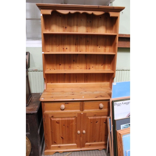 144 - A contemporary pine dresser with plate rack back, base fitted two drawers over two cupboard doors, 1... 