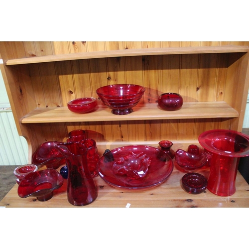 145 - A large & varied selection of red coloured glass, to include many Cranberry examples