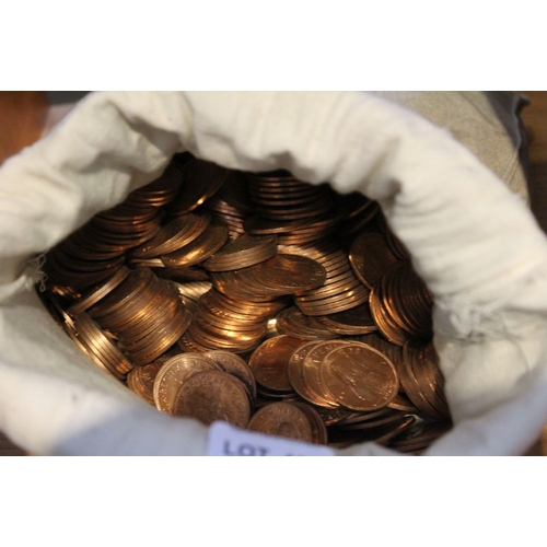 195 - A bag containing a large volume of old 1d coins, 13kg in weight