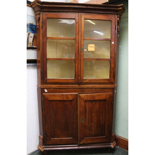 261 - A substantial glazed shelved corner cupboard