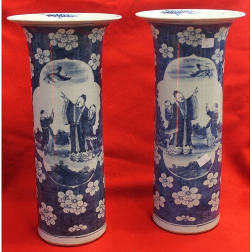 426 - A pair of Chinese porcelain cylinder vases, with flared rims, blue cobalt painted decoration, panels... 