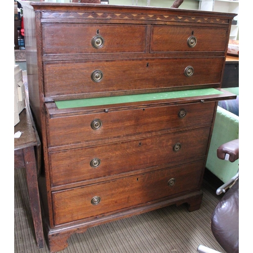 430 - A 19th century oak chest on two short over four long drawers, with brass ring handles, fitted baize ... 