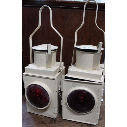 434 - A pair of cream painted tin lanterns, with red lenses