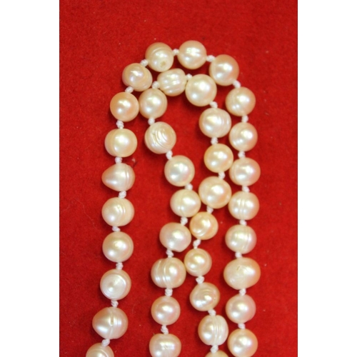 50 - A cultured pearl single long strand necklace, doubled 97cm