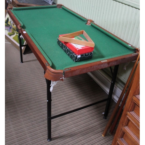 A small Ambassador mahogany framed snooker table on folding legs ...