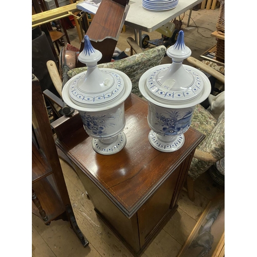 34 - Pair of blue & white china urns & lids