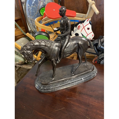 833 - Bronze horse & jockey on a marble base