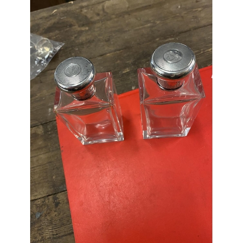 671 - Pair of silver hallmarked topped bottles