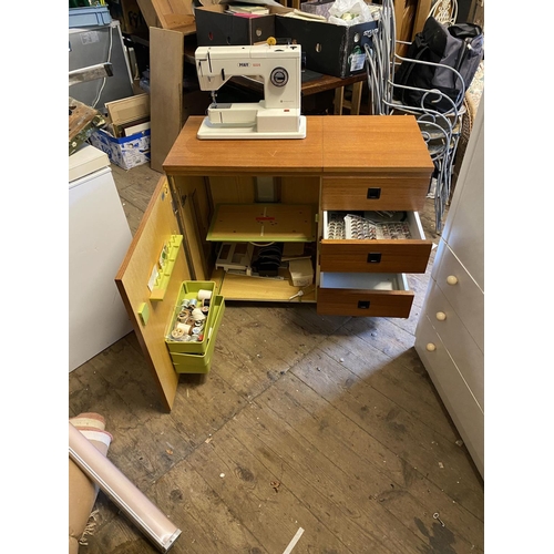 493 - Sewing machine,cabinet & accessories