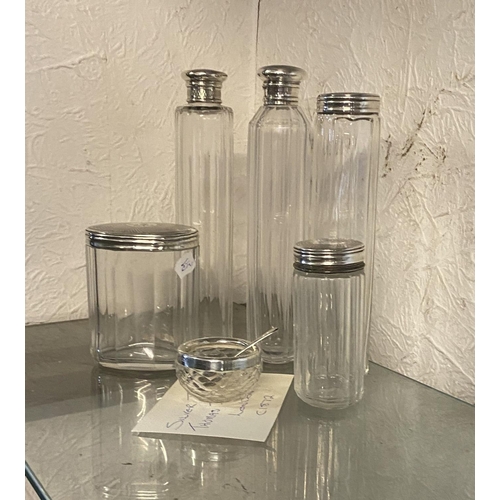 788 - Silver top glass jars