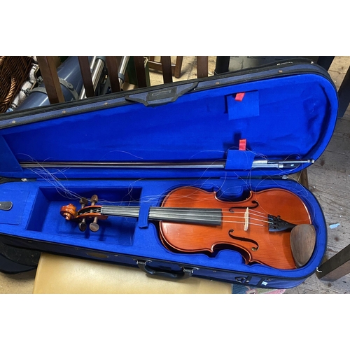 7 - Cased violin