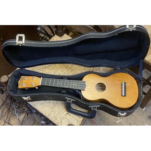 119 - Cased mini guitar