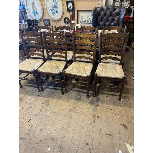 300 - Set of 8 oak ladder back chairs with rush seats