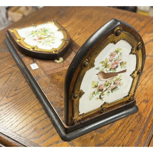 32 - Victorian walnut extending book rack with inserted porcelain panels