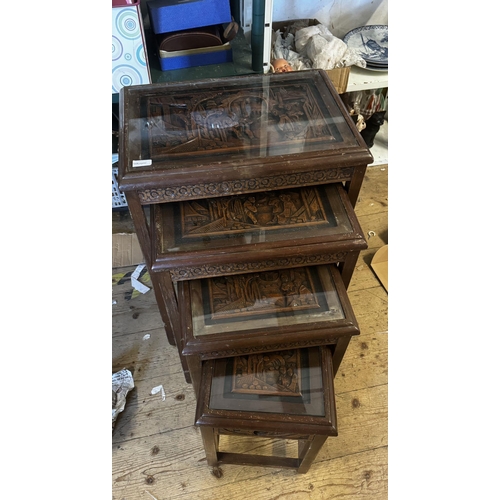 315 - Nest of 4 carved oriental tables