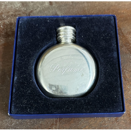 64 - Silver plated perfume bottle