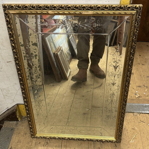 239 - Bevelled mirro in gilt frame