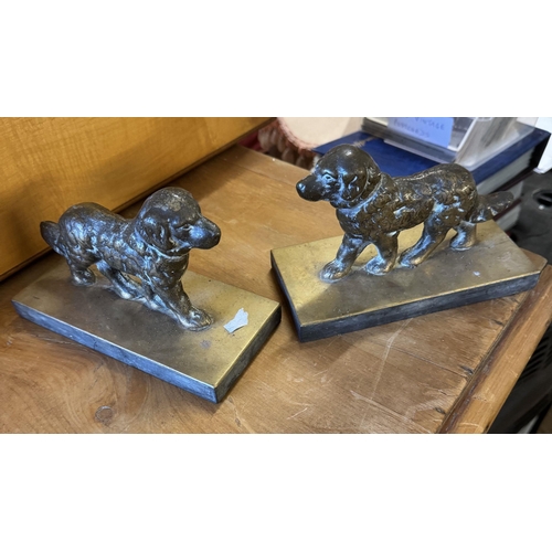 39 - Pair cast brass dogs on slate bases